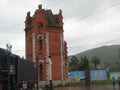 A water tower, a monument to V. I. Lenin and a steam locomotive in the center of the city of Slyudyanka on the shore of Lake Baika