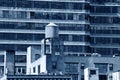 Water tower on the roof of a building, Black and white blue toned Royalty Free Stock Photo