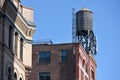 Water tower on the roof of a building Royalty Free Stock Photo