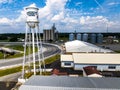 the water tower is shown next to a parking lot and water storage