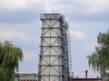 The water tower is steel construction protected by slate. Construction technology. Industrial architecture. Working space. Royalty Free Stock Photo