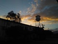 A water tower and the sunset