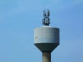 Water tower with telecommunication transmitter tower Royalty Free Stock Photo