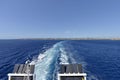 Water trail foaming behind a ferry boat in Mediterranean between Menorca islands, Spain.