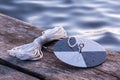 Water transpacency measurement disk with rope on a wooden dock Royalty Free Stock Photo