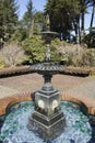 Water trickling over a fountain on a sunny day at Shore Acres State Park, Oregon