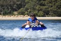 River water tubing skiing teen boy Royalty Free Stock Photo