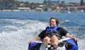 River water tubing skiing teen boy