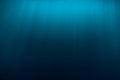 Water underwater and sun rays. Blue ocean in underwater