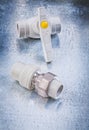 Water valve threaded pipe connectors on metallic background vert Royalty Free Stock Photo