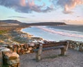 Water, view and beach sunset with peace, beauty and location tranquility in nature. Sea bench, freedom and ocean sunrise Royalty Free Stock Photo