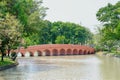 A red bridge across a lake at Chatujak district in downtown of Bangkok Thailand Royalty Free Stock Photo