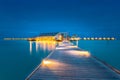 Water villas on Maldives resort island in sunset Royalty Free Stock Photo