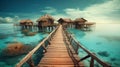 Water Villas (Bungalows) and wooden bridge at Tropical beach in the Maldives at summer day