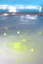 Water volcano releases yellow spheres that jump from the water surface