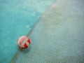 A Water volleyball floating on water in the swimming pool in a rainy day Royalty Free Stock Photo