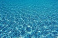 Water wave in swimming pool with light reflecting. Texture background Royalty Free Stock Photo