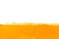 Water waves with air bubbles on a white background isolated. yellow orange juice Royalty Free Stock Photo