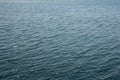 Water waves on the blue sea with bokeh. Wallpaper  Background. Royalty Free Stock Photo