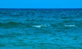 Water waves closing in to the shoreline or beach, the wavy waters of the Black Sea on a windy summer day