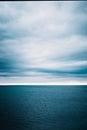 Water waves on cloudy sky background Royalty Free Stock Photo