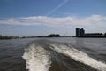 Water waves of the jet streams on the river Lek made by the Waterbus at high speed Royalty Free Stock Photo