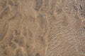 Water waves passing over sand on a beach Royalty Free Stock Photo