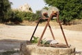 A water well with an old bucket Royalty Free Stock Photo