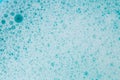 water with white foam bubbles.Cleanliness and hygiene. Foam Water Soap Suds.Texture Foam. blue soap bubbles background Royalty Free Stock Photo