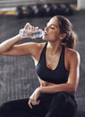 Water, woman and floor for tired and rest, gym and exercise for fitness and fatigue. Sweat, training and sports centre Royalty Free Stock Photo