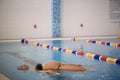 Water Yoga, a pregnant woman does her yoga exercises at the pool Royalty Free Stock Photo