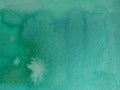 Watercolor background in green and turquoise.