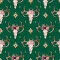 Watercolor boho seamless pattern of deer skull with antlers & floral arrangement on green background
