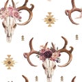 Watercolor boho seamless pattern of deer skull with antlers & floral arrangement on white background