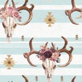 Watercolor boho seamless pattern of deer skull with antlers & floral arrangement on white blue background
