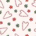 Watercolor candy cane, peppermint candy, seamless pattern on background.