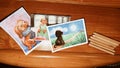 Watercolor cards with cute funny dogs and color pencils on wooden table. Childrens art. Illustrations with puppy on Royalty Free Stock Photo