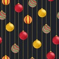 Watercolor christmas hanging balls of red, green and yellow colors seamless pattern on the black background. Royalty Free Stock Photo