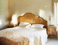 Watercolor of A cozy Bedroom with a wicker headboard and chintz