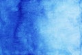 Watercolor deep blue gradient background. Hand painted calm watercolour backdrop. Stains on paper