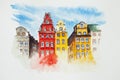 Watercolor drawing of an old town isolated on the white background. Illustration of colorful old buildings