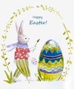 Easter bunny paints an egg. Easter card.
