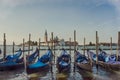 Watercolor effect of gondolas pier row anchored photo on Canal Grande with San Giorgio Maggiore church in the background, Venice, Royalty Free Stock Photo