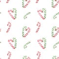 Watercolor festive winter seamless pattern with green and red striped candy canes.Christmas holiday design for textile, cards