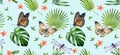 Watercolor floral seamless pattern. Monarch butterflies, dragonflies and palm leaves on light blue background. Tropical