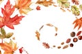 Watercolor frame with bright multicolored autumn leaves and maple winglets, chestnut fruits, oak acorns and pine cones