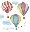 Watercolor hot air balloon polka dot set. Hand drawn vintage air balloons with flags garlands, clouds and retro design Royalty Free Stock Photo