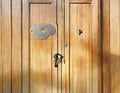 Watercolor of house key in front of a keyhole of a wooden door Royalty Free Stock Photo
