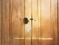 Watercolor of house key in front of a keyhole of a wooden door Royalty Free Stock Photo