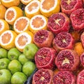 Sales stand for juice of apples, oranges and pomegranates with sliced fruits Royalty Free Stock Photo